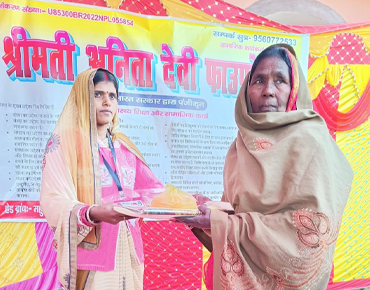 A young woman donating clothes and food to an elderly lady, illustrating women empowerment through community aid and intergenerational solidarity